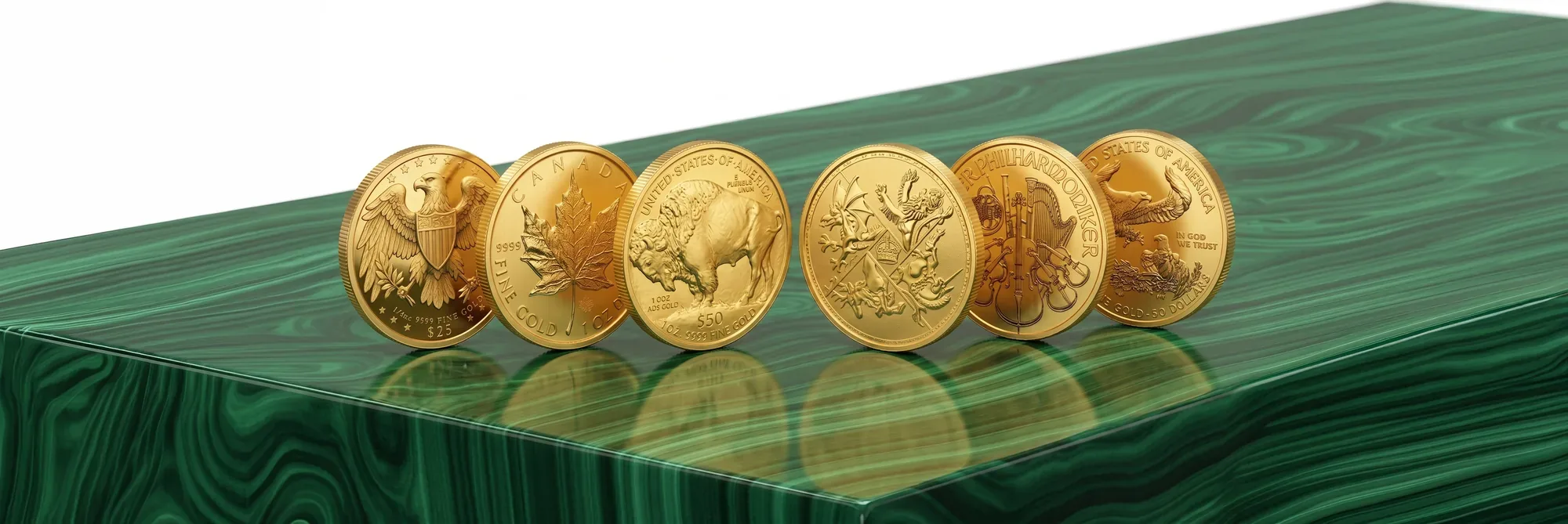 IRA-eligible gold bullion coins — American Eagle, Canadian Maple Leaf, American Buffalo and Austrian Philharmonic — in a row on a polished malachite table